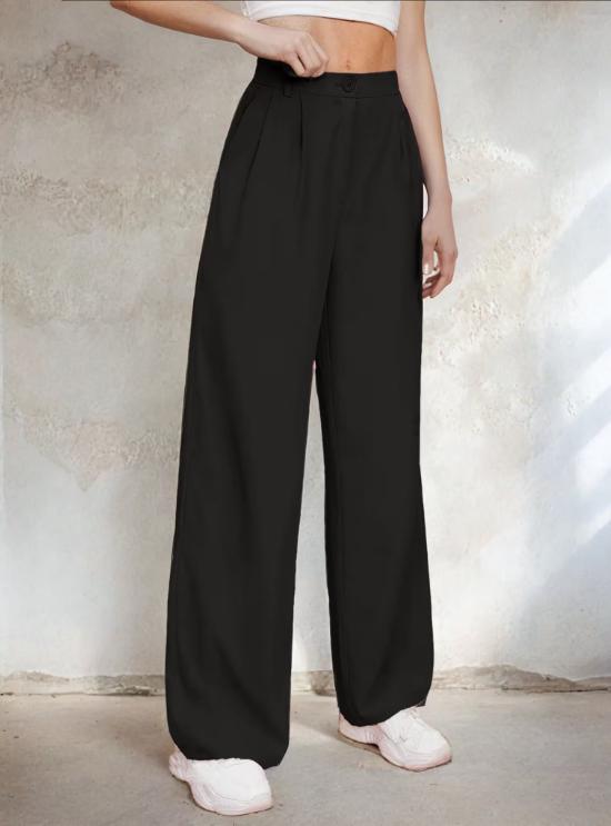 a woman in a white shirt and black pants